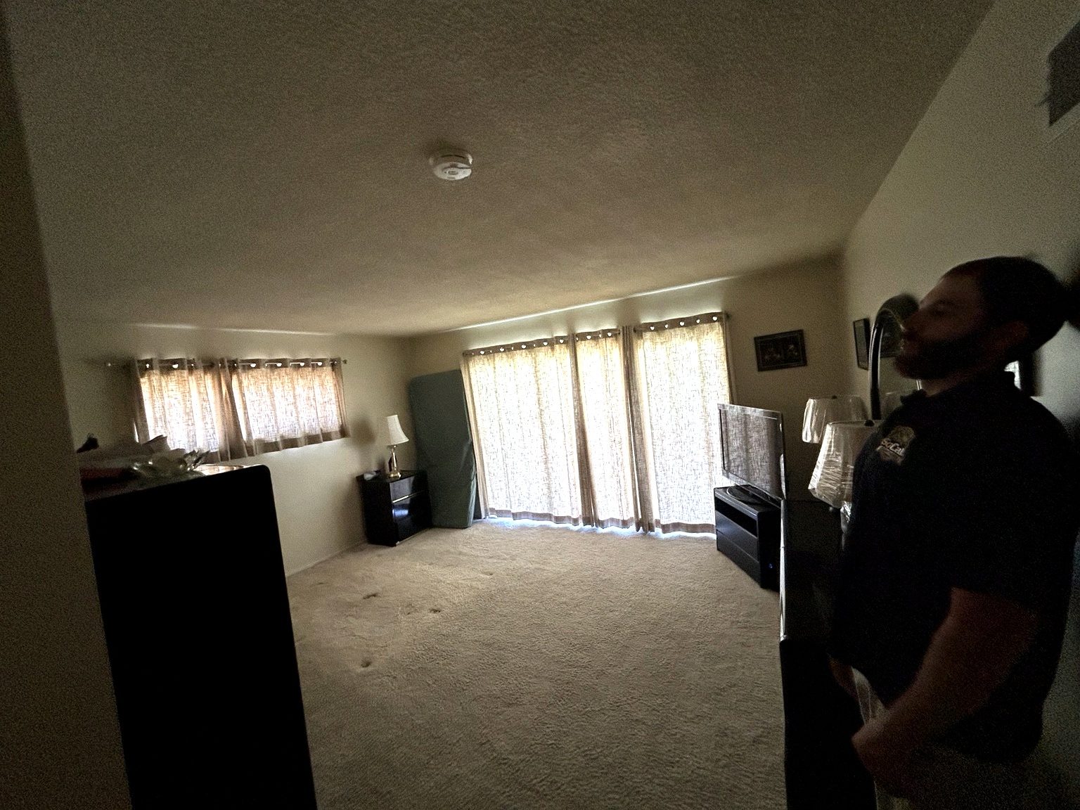 Owner working in living room during cleanout